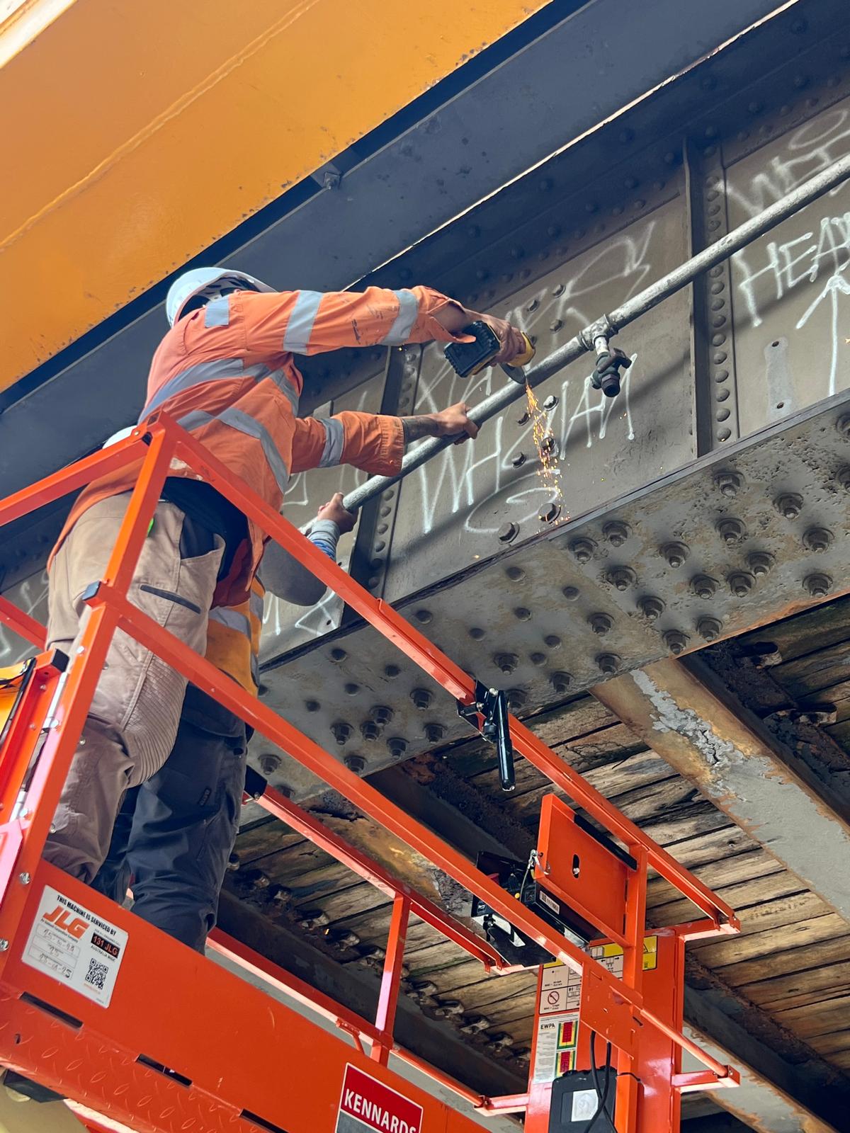 Bridge maintenance with elevated work platform